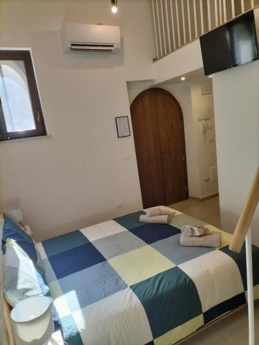 Postel nebo postele na pokoji v ubytování L'Alloggio del Fattore