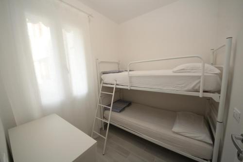 Postel nebo postele na pokoji v ubytování Villa Manu appartamento 02