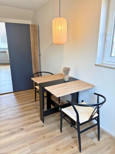 a dining room with a table and two chairs at Apartment Ikigai in Cochem