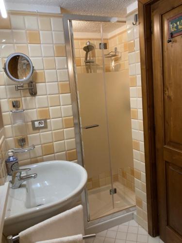 a bathroom with a sink and a shower at Sogni d'Oro Spello in Spello