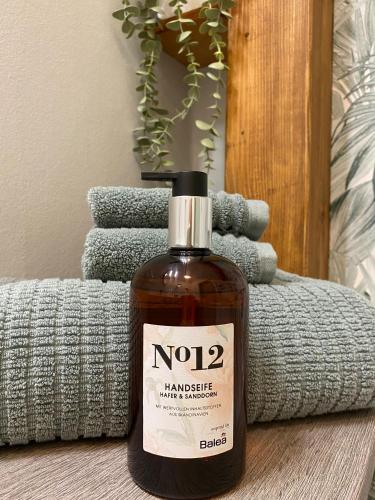 a bottle of no hammie vinegar and soap on a table at Appartement 105 in Egestorf