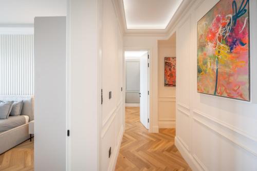 a living room with a couch and a painting on the wall at 2br luxury design with sea views from every room in Sliema in Sliema