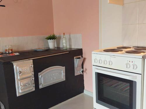 a kitchen with a stove and an oven at Taideniityn Maa 1 - 4lle in Varkaus
