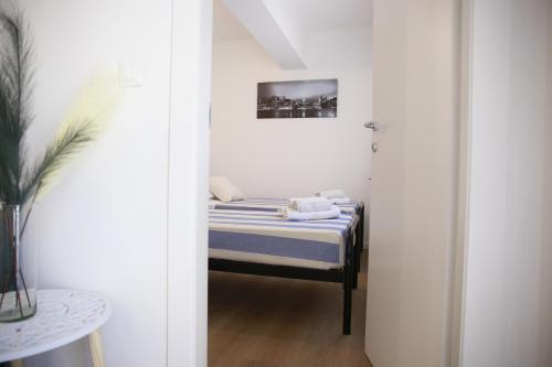 a small bedroom with a bed in a room at Rimini Casa Vacanze 2 in Rimini