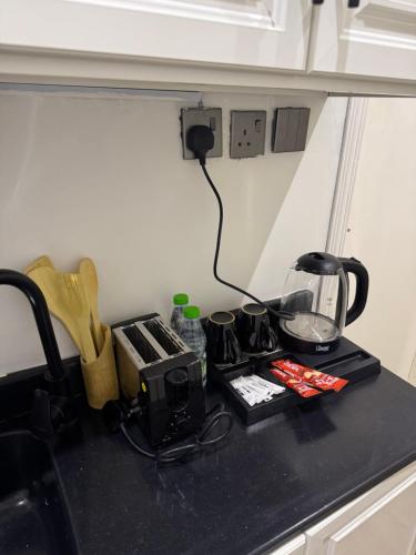 a kitchen counter top with a coffee maker on it at شقة مقابل البوليفارد in Riyadh