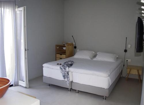 Кровать или кровати в номере SifnosLiving - Pleasure