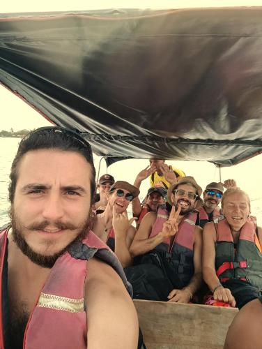a group of people in the back of a boat at Hostel Nugeku in Rincón