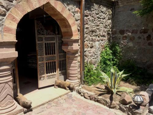 an entrance to a stone building with a door at Dream House by the Aegean Coast in Dikili