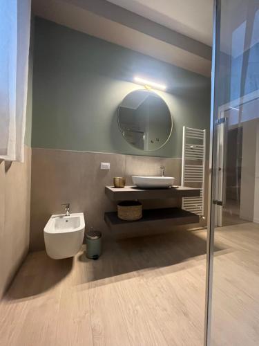a bathroom with a sink and a mirror at AL 31 Bg in Bergamo
