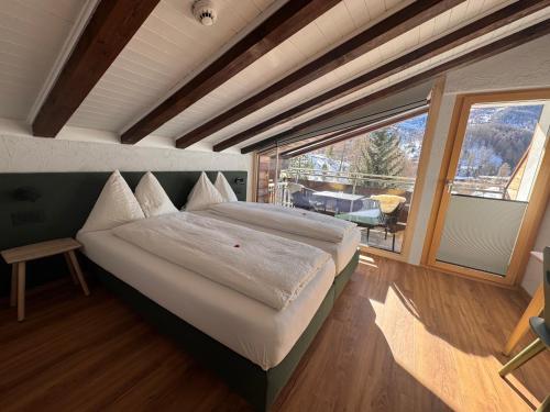 Postel nebo postele na pokoji v ubytování Hotel Plateau Rosa