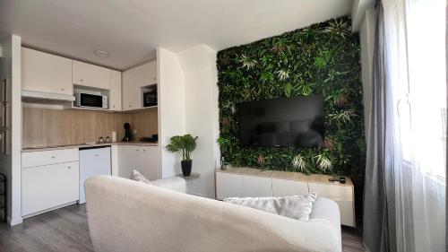 Ozoir-la-Ferrièreにある*Stud'Oz* Paris - Disneyland - Val d'Europeのリビングルーム(ソファ付)