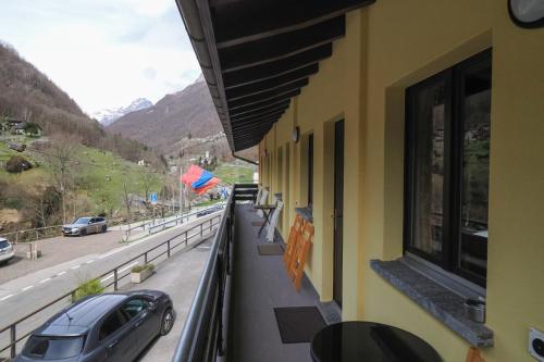 a car is parked on the balcony of a building at Osteria Posse in Lavertezzo