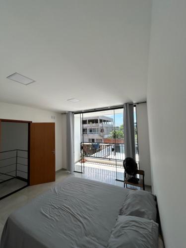 Ένα ή περισσότερα κρεβάτια σε δωμάτιο στο Casa Alves