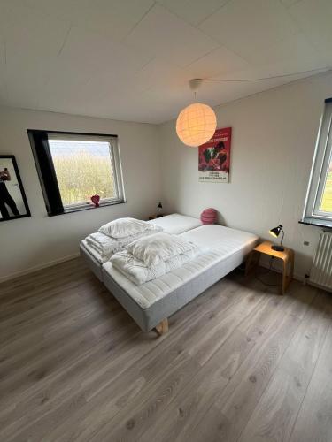 a bedroom with a large bed in a room at Casa Egevænget - 400 meters to LEGO HOUSE and Shopping in Billund