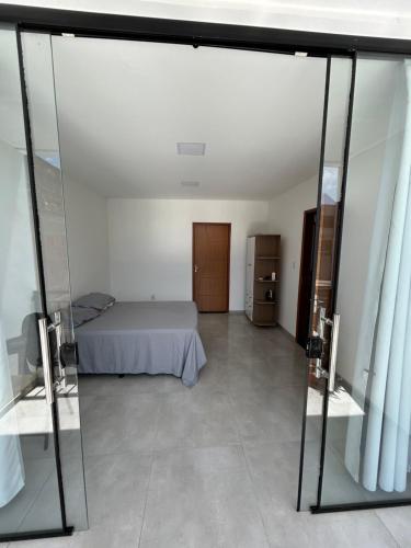 Ένα ή περισσότερα κρεβάτια σε δωμάτιο στο Casa Alves