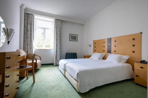 Postel nebo postele na pokoji v ubytování Hotel Das Termas