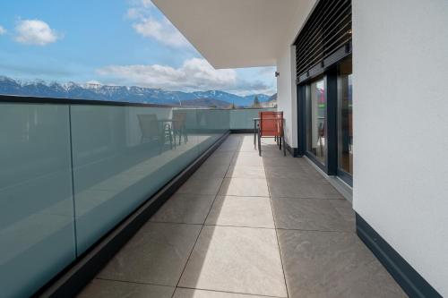 a balcony with a view of the mountains at Amaria Downtown Aparthotel Villach in Villach