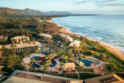 an aerial view of a resort next to the ocean at Mountain View, 4 Star Beachfront Resort, Lanai, AC, Pool, Restaurant, Gym, Spa in Lihue
