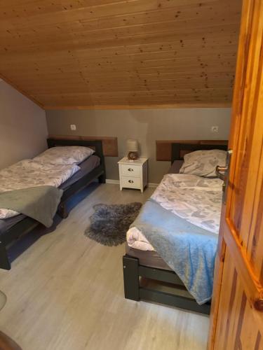 Posteľ alebo postele v izbe v ubytovaní Lawendowe Domki 70m