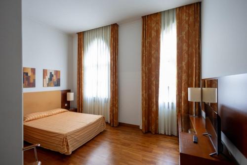 Postel nebo postele na pokoji v ubytování Hotel Apartamentos Geres Ribeiro