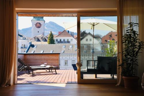 a sliding glass door with a view of a balcony at Exklusive Dachgeschoß-Suite mit Sauna & Terrasse in Waidhofen an der Ybbs