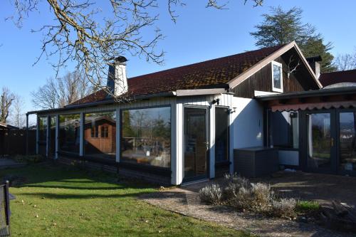 an extension to a house with sliding glass doors at Ferienhaus Bella Vista Edersee in Vöhl