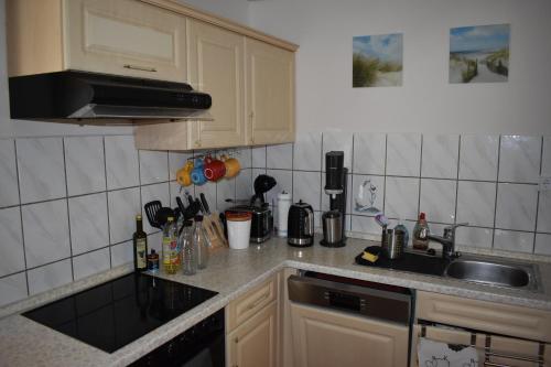 a kitchen with a sink and a counter top at Ferienhaus Bella Vista Edersee in Vöhl