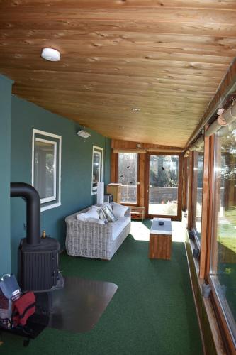a room with a bed and a fireplace in a house at Ferienhaus Bella Vista Edersee in Vöhl
