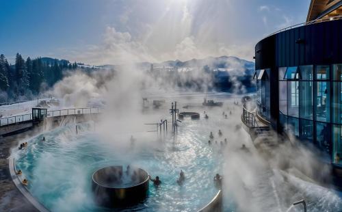 a group of people in a hot tub in a geyser at Cracow Route #2 - Old Town in Kraków
