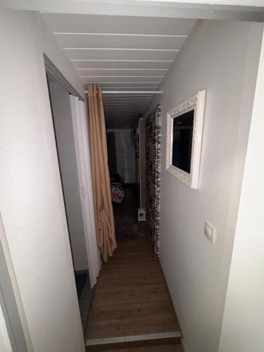 a hallway with a hallway leading to a room with a hallway at Charmant T1 au calme in Cernay