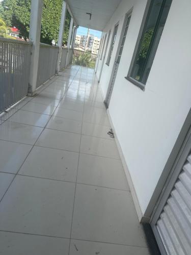an empty hallway of a house with white walls at Espaço Paulo Henrique in Ananindeua