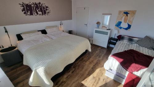 Postel nebo postele na pokoji v ubytování Moderne Wohnung Cathy