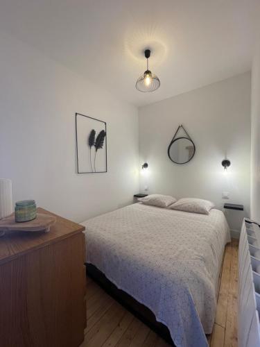 Ένα ή περισσότερα κρεβάτια σε δωμάτιο στο Appartement 6 pers totalement rénové