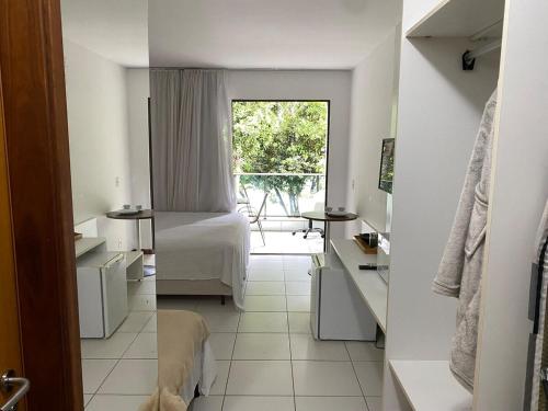 Ένα ή περισσότερα κρεβάτια σε δωμάτιο στο Apartamento Studio ILOA Resid 101V