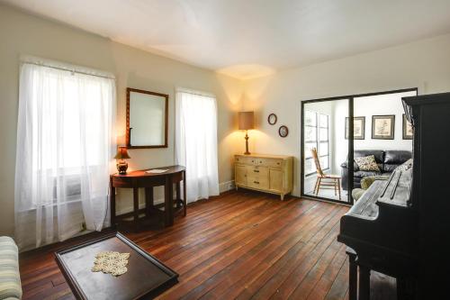a living room with a table and a mirror at Peaceful Pomona Park Home 1 Mi to Lake Broward! in Satsuma