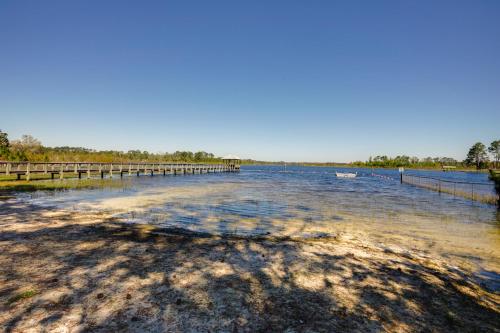 a large body of water with a wooden bridge at Peaceful Pomona Park Home 1 Mi to Lake Broward! in Satsuma