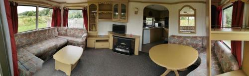 a living room with a couch and a table in a bus at Culver in Newport