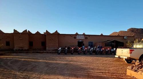 a group of motorcycles parked in front of a building at Auberge Dar Lajdoud in Tafraoute Sidi Ali