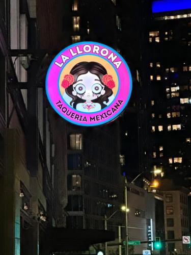 a neon sign for a margarita margarita restaurant at Moore Hotel in Seattle