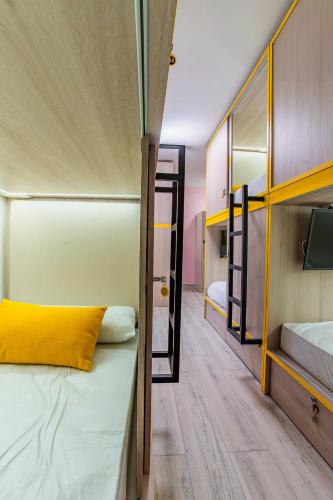 a room with two bunk beds and a tv at APTC ETXEa in Vitoria-Gasteiz