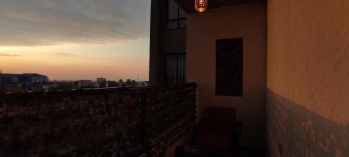 a view of a sunset from a balcony of a building at Serene Hills Home in Nairobi