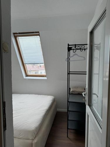 a bedroom with a bunk bed and a window at ApartmentGjilanCenter in Gjilan