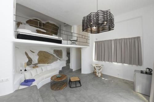 a living room with a couch and a table at Lux Private Estate Endless Sea & Sky View in Plintri