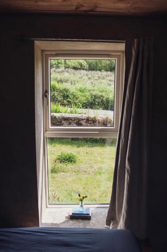 a window with a view of a field of grass at Silverhill House, Miltown Malbay in Miltown Malbay