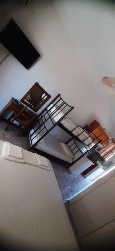 a room with metal shelves on the ceiling at MAKRIS Studios in Yiáltra