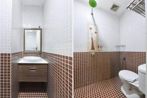 a bathroom with a toilet and a sink at Hotel O G Home Hotel, Kota Bharu, Kelantan. in Kota Bharu