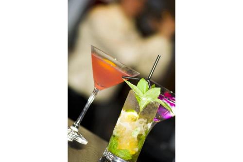 a couple of cocktails sitting on a table at OYO The Leven in Stokesley