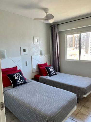a room with two beds and a window at First line, upscale apartment Los Cristianos! 11thFloor Views in Arona
