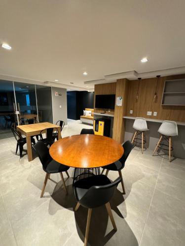 a conference room with tables and chairs in a building at Studio, Próximo ao Consulado EUA in Porto Alegre