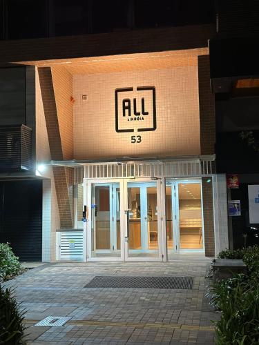 a building with a sign on the front of it at Studio, Próximo ao Consulado EUA in Porto Alegre